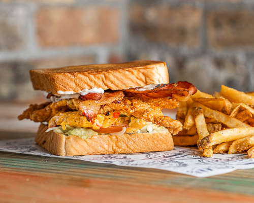 Texas Fried Chicken Clubhouse sandwich with fries