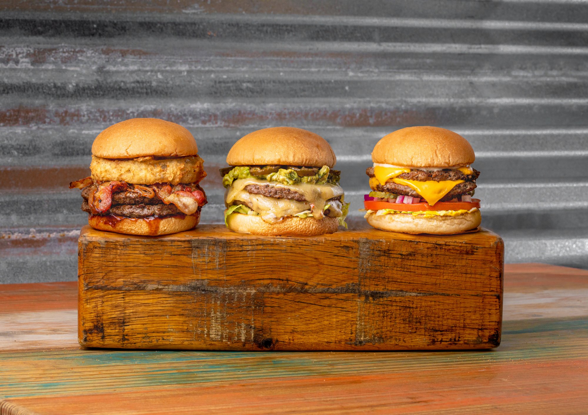 Burger Trio Photoshopped (Larger Guac Burger)_